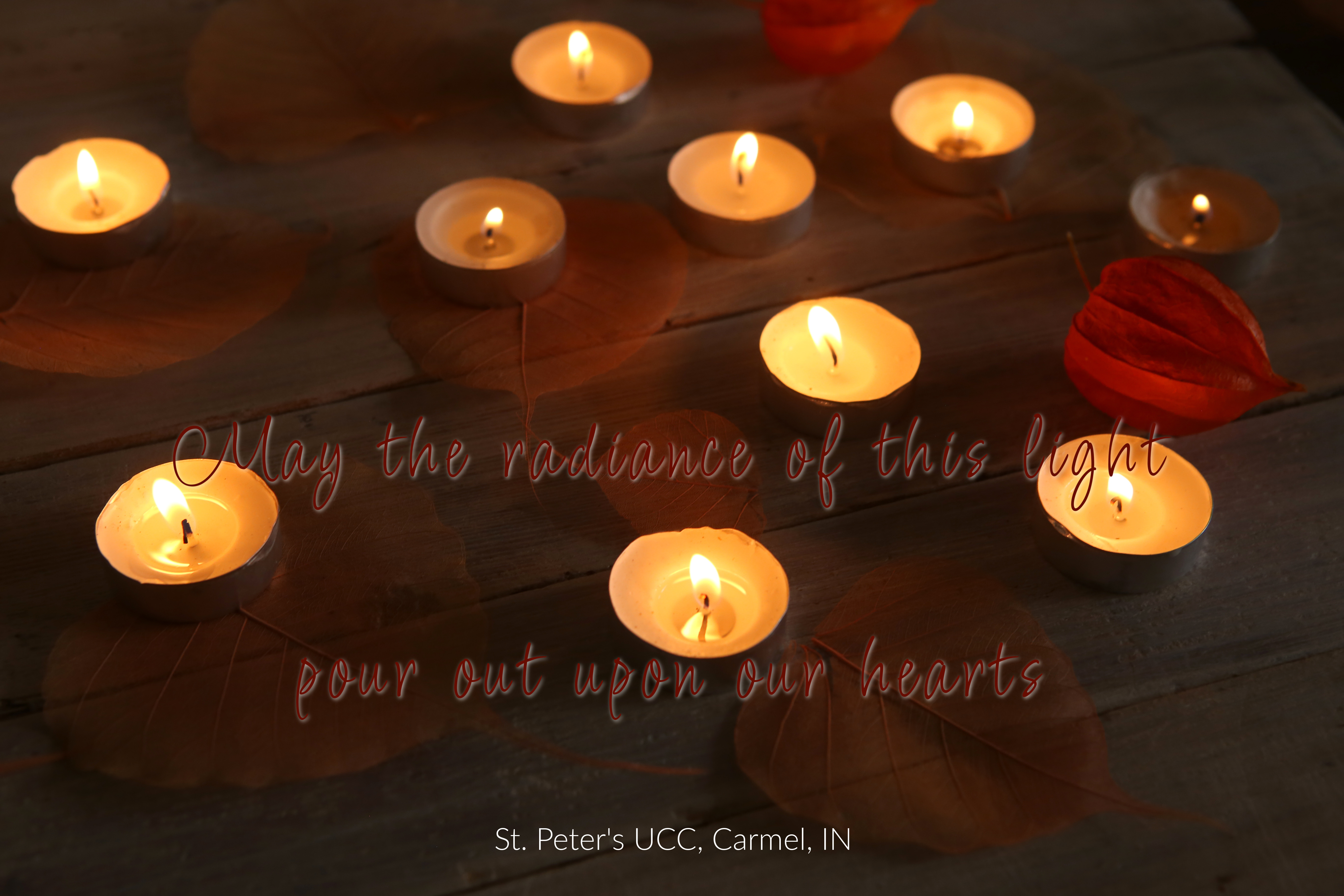 May the radiance of this light pour out Brown table with 8 votive  candles and a few red petals. The words are May the radiance of this light pour out upon our hearts.